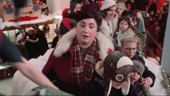 Movie still from “A Christmas Story” (1983), directed by Bob Clark – A crowd of people wearing hats and coats; Close Up shot, Over the shoulder angle