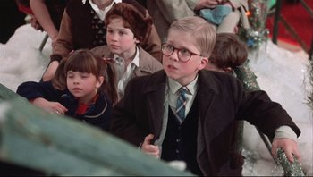 Movie still from “A Christmas Story” (1983), directed by Bob Clark – A group of children sitting next to each other in a room; Medium shot, Low angle
