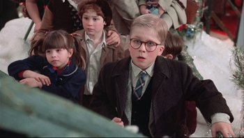 Movie still from “A Christmas Story” (1983), directed by Bob Clark – A group of children sitting in a room; Close Up shot, Low angle