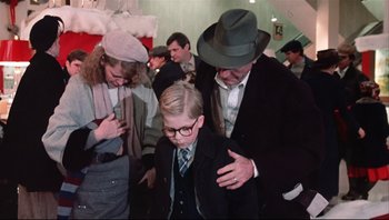 Movie still from “A Christmas Story” (1983), directed by Bob Clark – A group of people standing next to each other; Medium shot, Low angle