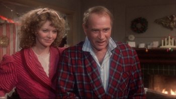 Movie still from “A Christmas Story” (1983), directed by Bob Clark – A man and a woman standing next to each other; Medium shot, Over the shoulder angle