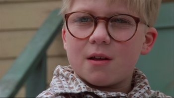 Movie still from “A Christmas Story” (1983), directed by Bob Clark – A person wearing glasses; Close Up shot, Low angle