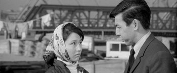 Movie still from “A Colt Is My Passport” (1967), directed by Takashi Nomura – A man and a woman talking to each other; Close Up shot, Over the shoulder angle