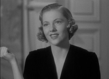 Movie still from “A Damsel in Distress” (1937), directed by George Stevens – An old photo of a woman in a black dress; Close Up shot, Low angle