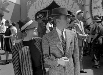 Movie still from “A Damsel in Distress” (1937), directed by George Stevens – A man and a woman standing next to each other; Medium shot, Low angle