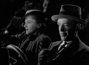 Movie still from “A Damsel in Distress” (1937), directed by George Stevens – A man and a woman sitting in a car in the dark; Close Up shot, Low angle