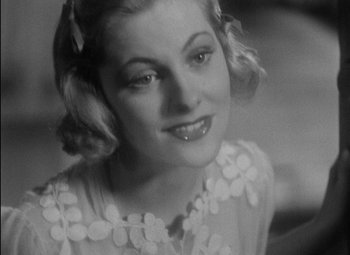 Movie still from “A Damsel in Distress” (1937), directed by George Stevens – A black - and - white photo of a young woman; Close Up shot, High angle