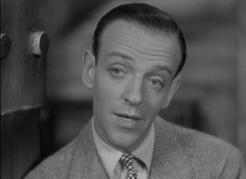 Movie still from “A Damsel in Distress” (1937), directed by George Stevens – A black - and - white photo of fred astaire; Close Up shot, High angle
