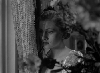 Movie still from “A Damsel in Distress” (1937), directed by George Stevens – A black - and - white photo of a woman looking at the camera; Close Up shot, High angle