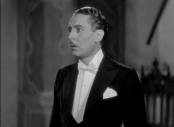 Movie still from “A Damsel in Distress” (1937), directed by George Stevens – A man in a tuxedo is looking to his left; Close Up shot, Low angle