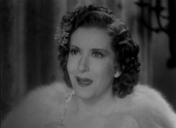 Movie still from “A Damsel in Distress” (1937), directed by George Stevens – An old photo of a woman in a fur coat; Close Up shot, High angle