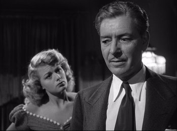 Movie still from “A Double Life” (1947), directed by George Cukor – A man and a woman standing next to each other in a room; Close Up shot, Low angle