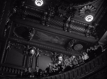Movie still from “A Double Life” (1947), directed by George Cukor – A group of people standing on top of a staircase; Extreme Wide shot, High angle