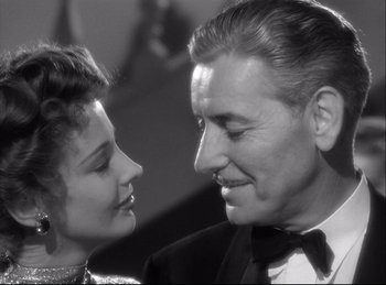 Movie still from “A Double Life” (1947), directed by George Cukor – An older man and a younger woman looking at each other; Close Up shot, Low angle