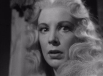 Movie still from “A Double Life” (1947), directed by George Cukor – A black - and - white photo of a woman's face; Close Up shot, Low angle