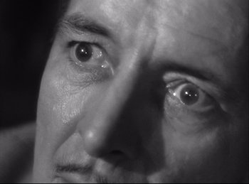 Movie still from “A Double Life” (1947), directed by George Cukor – A man's eyes with tears coming out of them; Extreme Close Up shot, High angle