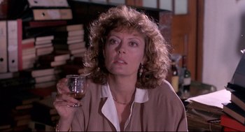 Movie still from “A Dry White Season” (1989), directed by Euzhan Palcy – A person holding a glass of wine; Close Up shot, Over the shoulder angle