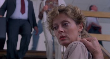 Movie still from “A Dry White Season” (1989), directed by Euzhan Palcy – A person wearing a suit and tie; Close Up shot, Low angle