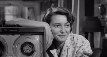 Movie still from “A Face in the Crowd” (1957), directed by Elia Kazan – An old photo of a woman leaning against a radio; Close Up shot, Low angle