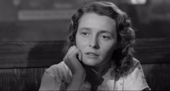 Movie still from “A Face in the Crowd” (1957), directed by Elia Kazan – An old black and white photo of a woman; Close Up shot, High angle