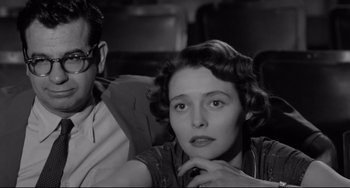 Movie still from “A Face in the Crowd” (1957), directed by Elia Kazan – An older woman sitting next to an older man; Close Up shot, Low angle