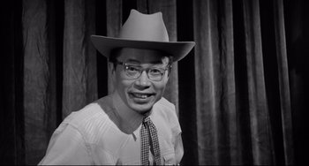 Movie still from “A Face in the Crowd” (1957), directed by Elia Kazan – A black and white photo of a man wearing a hat; Close Up shot, Low angle