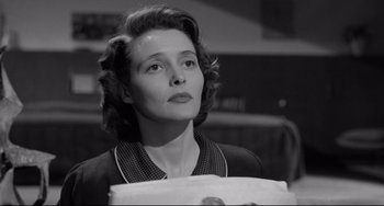 Movie still from “A Face in the Crowd” (1957), directed by Elia Kazan – An old photo of a woman holding a piece of paper; Close Up shot, Low angle