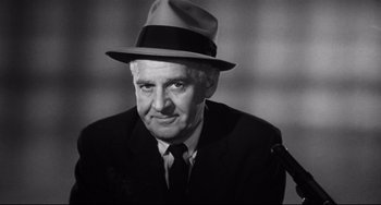 Movie still from “A Face in the Crowd” (1957), directed by Elia Kazan – An older man wearing a hat and a tie; Close Up shot, Low angle