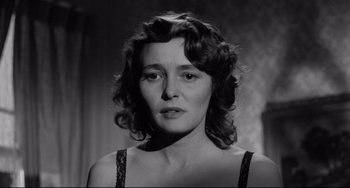 Movie still from “A Face in the Crowd” (1957), directed by Elia Kazan – An old photo of a woman in a black dress; Close Up shot, Low angle