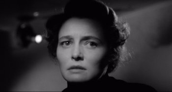 Movie still from “A Face in the Crowd” (1957), directed by Elia Kazan – An old photo of an older woman looking at the camera; Close Up shot, Low angle