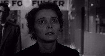 Movie still from “A Face in the Crowd” (1957), directed by Elia Kazan – A woman looking up at the sky in a black and white photo; Close Up shot, Low angle