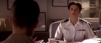 Movie still from “A Few Good Men” (1992), directed by Rob Reiner – A man sitting at a desk in front of another man; Close Up shot, Over the shoulder angle