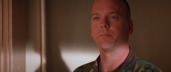Movie still from “A Few Good Men” (1992), directed by Rob Reiner – A person wearing a military uniform; Close Up shot, Low angle