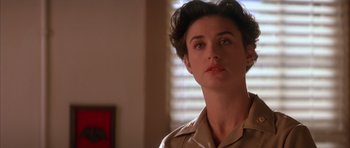 Movie still from “A Few Good Men” (1992), directed by Rob Reiner – A person with short hair wearing a uniform; Close Up shot, Low angle