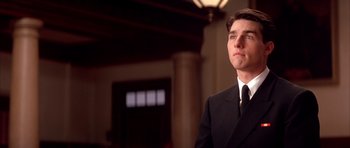 Movie still from “A Few Good Men” (1992), directed by Rob Reiner – A man in a suit and tie looking up; Close Up shot, Low angle