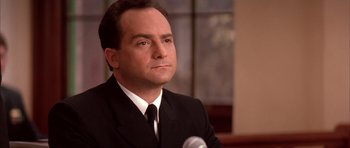 Movie still from “A Few Good Men” (1992), directed by Rob Reiner – A person wearing a suit and tie; Close Up shot, Low angle