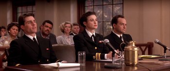 Movie still from “A Few Good Men” (1992), directed by Rob Reiner – A group of people sitting around a table; Medium shot, Low angle