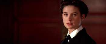 Movie still from “A Few Good Men” (1992), directed by Rob Reiner – A person wearing a suit and tie; Close Up shot, Over the shoulder angle