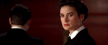 Movie still from “A Few Good Men” (1992), directed by Rob Reiner – A person wearing a suit and tie; Close Up shot, Over the shoulder angle