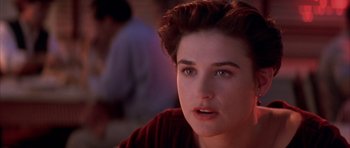 Movie still from “A Few Good Men” (1992), directed by Rob Reiner – A person with short brown hair; Close Up shot, Over the shoulder angle