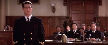 Movie still from “A Few Good Men” (1992), directed by Rob Reiner – A man standing in front of a group of people; Medium shot, Low angle