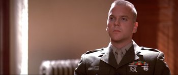 Movie still from “A Few Good Men” (1992), directed by Rob Reiner – A man in a military uniform looking to his left; Close Up shot, Low angle