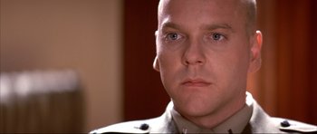 Movie still from “A Few Good Men” (1992), directed by Rob Reiner – A person wearing a military uniform; Close Up shot, Low angle