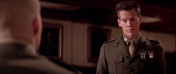 Movie still from “A Few Good Men” (1992), directed by Rob Reiner – A man in a military uniform standing in front of a mirror; Close Up shot, Low angle