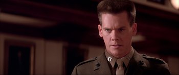 Movie still from “A Few Good Men” (1992), directed by Rob Reiner – A person wearing a uniform; Close Up shot, Low angle