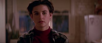 Movie still from “A Few Good Men” (1992), directed by Rob Reiner – A person wearing a plaid shirt; Close Up shot, Over the shoulder angle