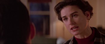 Movie still from “A Few Good Men” (1992), directed by Rob Reiner – A woman's face in front of a window; Close Up shot, Over the shoulder angle