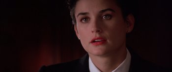 Movie still from “A Few Good Men” (1992), directed by Rob Reiner – A person wearing a suit and tie; Close Up shot, Over the shoulder angle