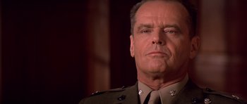 Movie still from “A Few Good Men” (1992), directed by Rob Reiner – A person wearing a military uniform; Close Up shot, Low angle