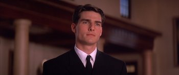 Movie still from “A Few Good Men” (1992), directed by Rob Reiner – A man in a black suit and white tie; Close Up shot, Low angle